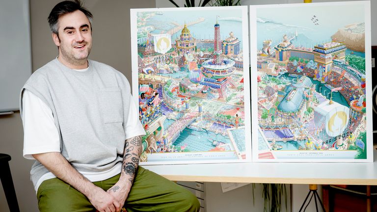 French artist Ugo Gattoni poses next to the Paris 2024 Olympic and Paralympic posters at his workshop, in Ivry-sur-Seine, outside Paris.
Pic: AP