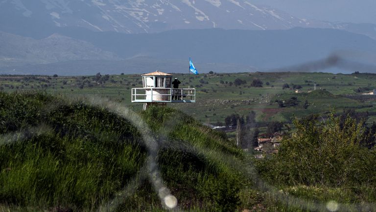 A U.N. peacekeeper guards at a post along the Israel-Syria border in the Israeli-occupied Golan Heights