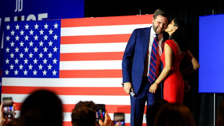 Republican Senate candidate JD Vance, left, is kissed by his wife Usha Vance, as he speaks to supporters during an election night watch party, Tuesday, May 3, 2022, in Cincinnati. (AP Photo/Aaron Doster)