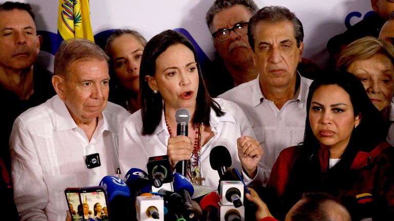 Venezuelan opposition leader Maria Corina Machado speaks to the media next to opposition presidential candidate Edmundo Gonzalez after the electoral authority announced that Venezuelan President Nicolas Maduro has won a third term, during the presidential election, in Caracas, Venezuela July 29, 2024. REUTERS/Leonardo Fernandez Viloria