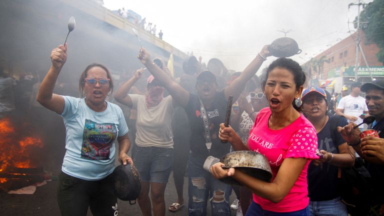 Demonstrators bang pots during the protests. Pic: Reuters