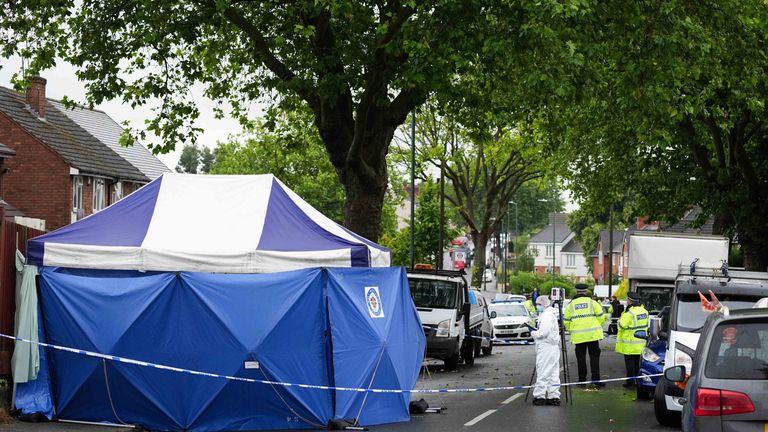 A scenes of crime officer at the scene of a fatal shooting in Well Lane, Walsall.
Pic: PA