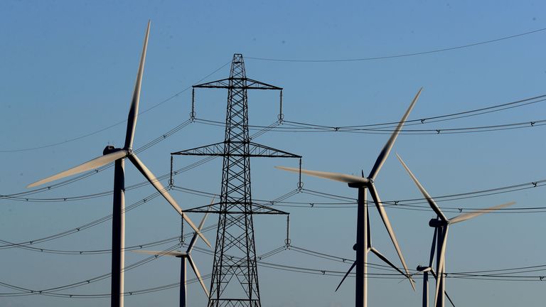 EMBARGOED TO 0001 THURSDAY JULY 18 File photo dated 28/12/17 of a view of the Little Cheyne Court Wind Farm amongst existing electricity pylons on the Romney Marsh in Kent. The Climate Change Committee's annual report on the UK's progress on cutting emissions warned rapid progress is needed to make up "lost ground" in decarbonising the economy, urging the Government to take immediate steps to deliver on recommendations from its climate advisers. Issue date: Thursday July 18, 2024.