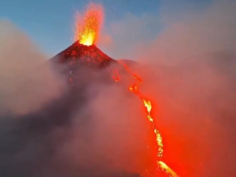 This video captures a waterfall of lava flowing from one of Mount Etna's  largest craters.