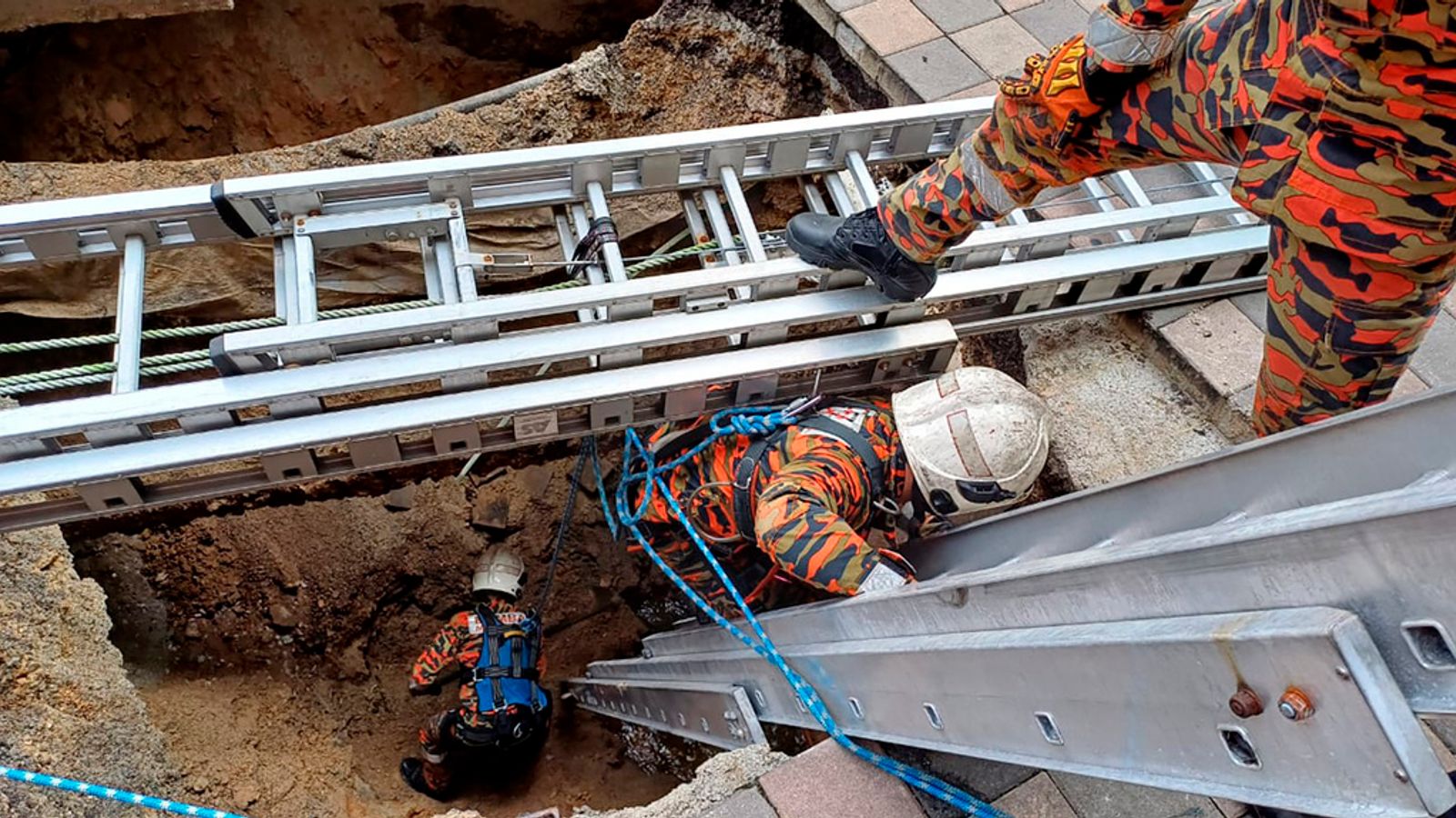 Malaysia sinkhole Woman missing after pavement collapses in Kuala