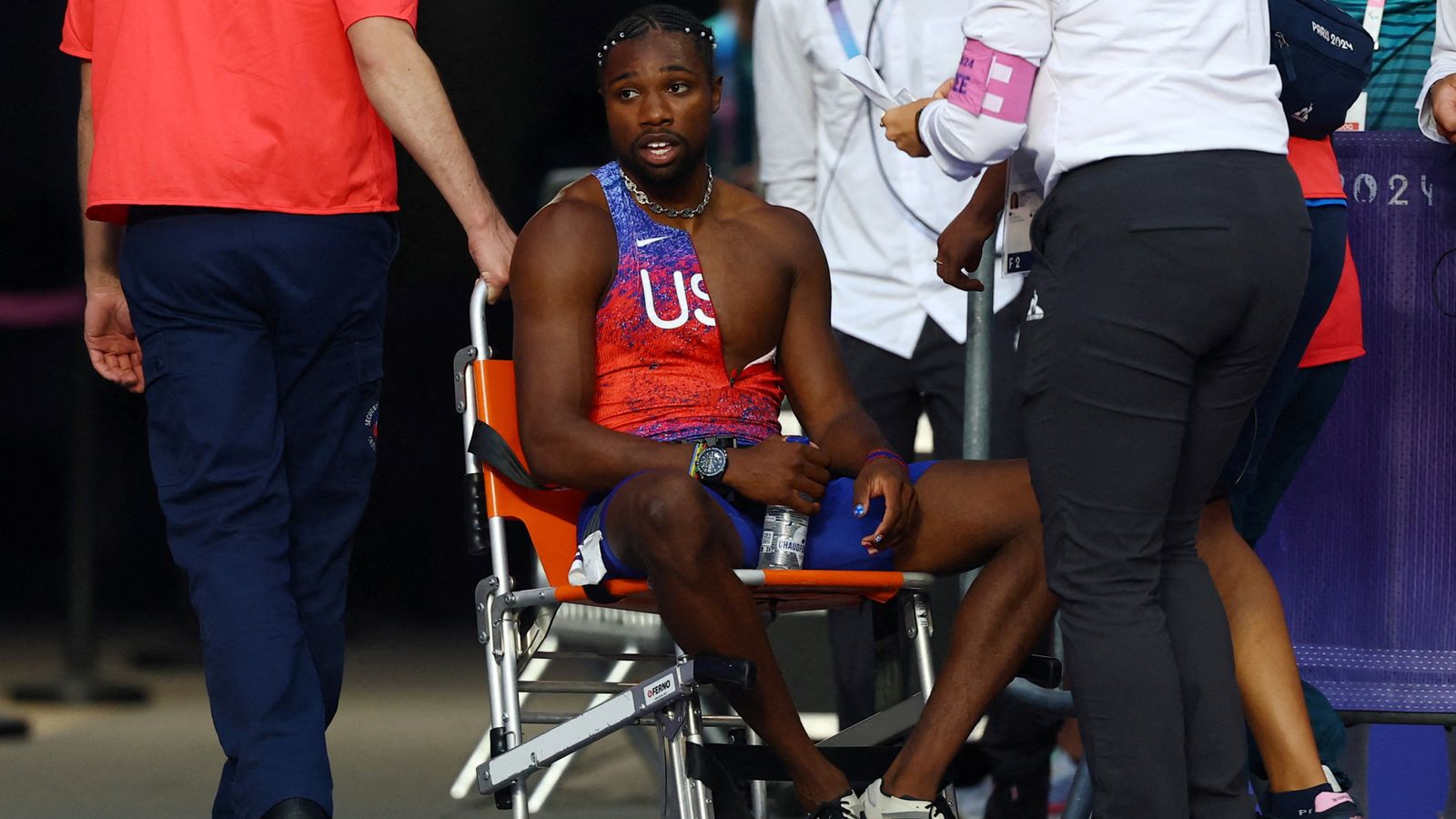 Noah Lyles: US sprinter diagnosed with COVID leaves Paris Olympics track in wheelchair after 200m final