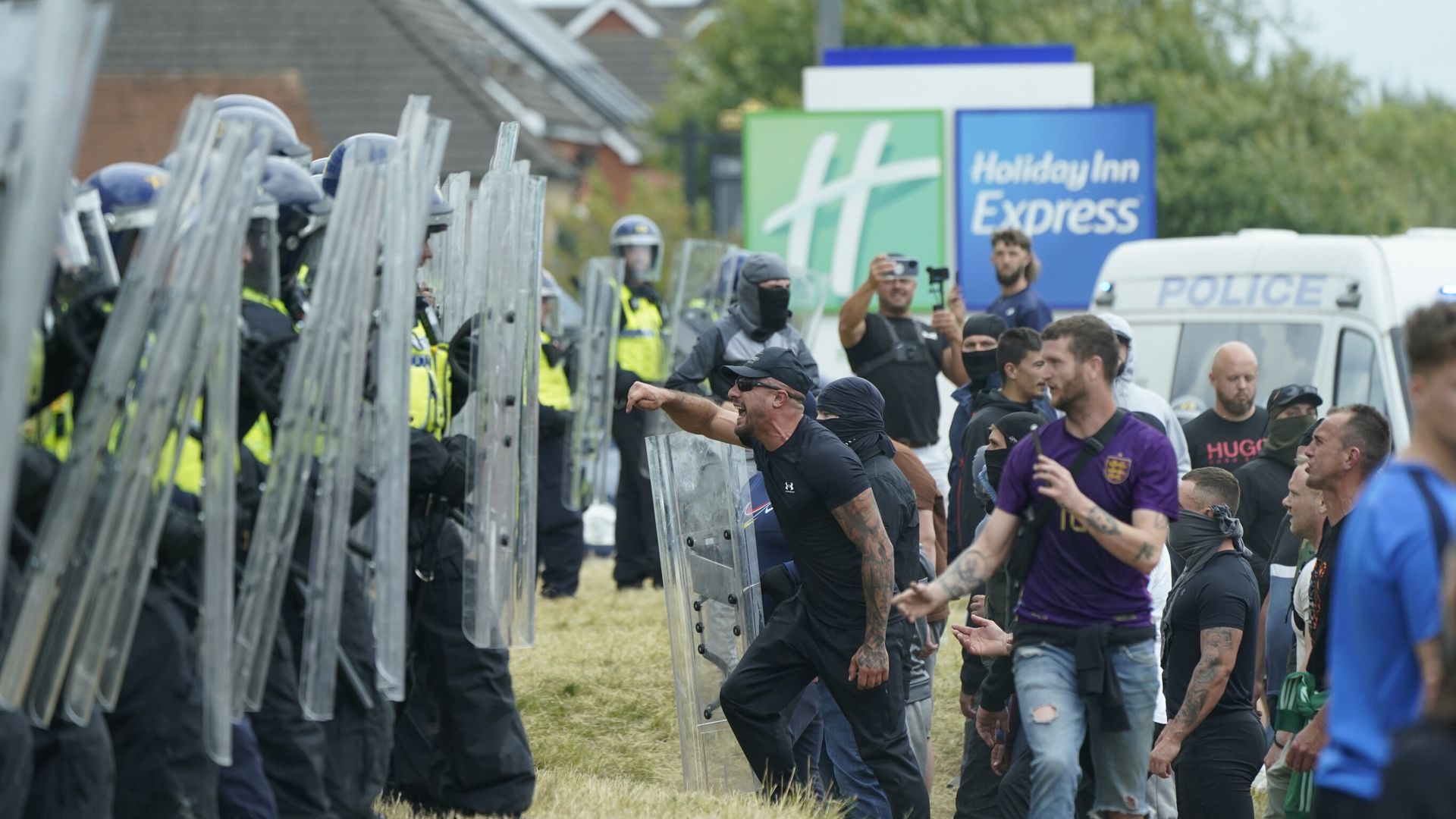 Rioters break into hotel as injured police officer carried away by colleagues