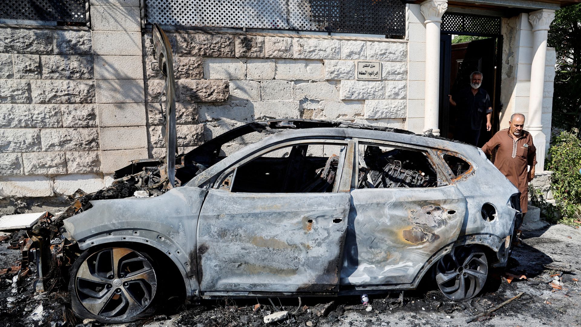 One dead after Israeli settlers attack West Bank village - with cars and homes on fire