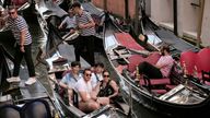 Day-trippers take a gondola tour, on the last day of the experimental 5 euro entry fee to visit Venice, in Venice, Italy, July 14, 2024. REUTERS/Manuel Silvestri 