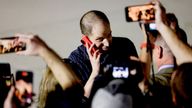 Evan Gershkovich speaks on a mobile phone at Joint Base Andrews in Maryland.
Pic: Reuters