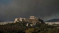 The Parthenon temple atop the Acropolis hill as smoke from a wildfire is seen, in Athens Greece, August 11, 2024. REUTERS/Elias Marcou TPX IMAGES OF THE DAY