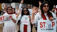 Indians protesting against the rape and killing of a trainee doctor at a government hospital in Kolkata hold placards in Mumbai, India, Monday, Aug. 19, 2024. (AP Photo/Rafiq Maqbool)