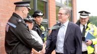 Prime Minister Sir Keir Starmer with West Midlands Chief Constable Craig Guildford greets members of the West Midlands Police Force as he arrives at Arden Academy in Solihull, West Midlands. Picture date: Thursday August 8, 2024. PA Photo. See PA story POLICE Southport. Photo credit should read: Joe Giddens/PA Wire