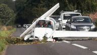 Pic: Mila Vukelić / SWNS

A pilot and passenger had a miracle escape after a light aircraft crashed onto a busy road. Photo released August 28 2024. The plane landed on the A419 in Gloucestershire - with emergency services scrambled to help. Great Western Air Ambulance was among the 999 crews called to reports of the downed powered glider at around 4.45pm on Tuesday afternoon (27 August). The incident happened close to Aston Down Airfield in Frampton Mansell between Cirencester and Stroud.