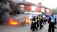 A car was set on fire by rioters in Middlesbrough on Sunday 4 August. Pic: PA