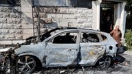 A Palestinian man walks near a vehicle burnt during an Israeli attack in the village of Jeit, near Qalqilya, in the Israeli-occupied West Bank.
Pic: Reuters