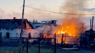 A building on fire in the town of Sudzha following an incursion of Ukrainian troops into the Kursk region, Russia.
Pic: MIC Izvestia/IZ.RU/Reuters

