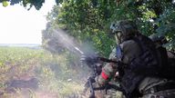 In this photo taken from video released by the Russian Defense Ministry on Monday, Aug. 19, 2024, Russian soldiers fire an AGS-17 automatic grenade launcher towards Ukrainian positions at an undisclosed location in the Russian - Ukrainian border area in ......the Kursk region, Russia. (Russian Defense Ministry Press Service photo via AP)