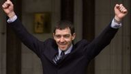 Tony McCarroll, sacked former drummer of the rock band Oasis, celebrates as he leaves the High Court March 2.