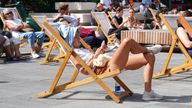 People out enjoying hot weather this month in Spitalfields, London. Pic: PA