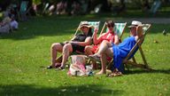 People enjoy the warm weather in St James' Park, London. Picture date: Friday August 2, 2024.