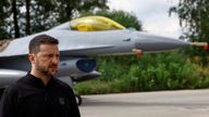 President Volodymyr Zelenskiy speaks to the media in front of an F-16 fighter jet. Pic: Reuters