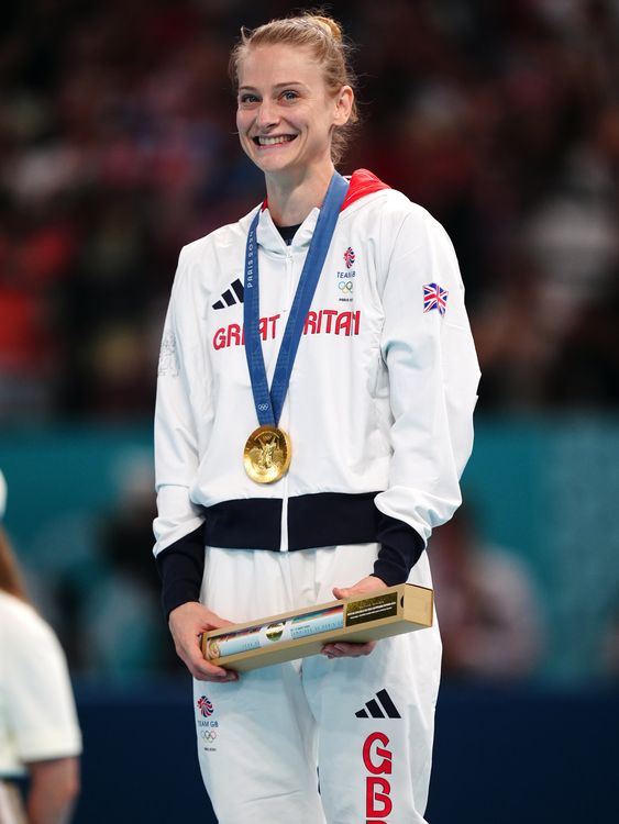 Bryony Page celebrates winning a gold medal at the Bercy Arena. Pic: PA