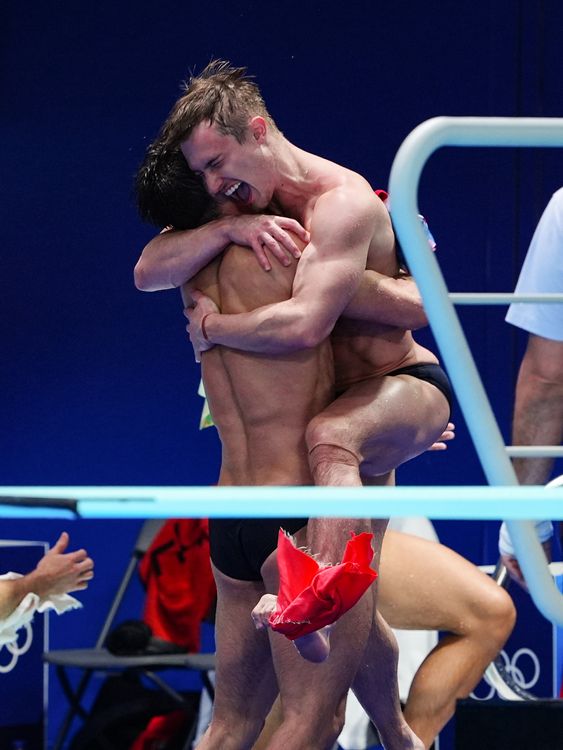 The British diving duo celebrate after bronze in the men's synchronised 3m springboard final. Pic: PA