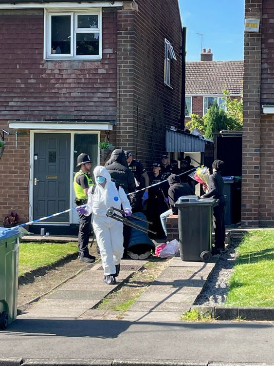 Police officers at the scene in Lovett Avenue, Oldbury after a 13-year-old boy has been stabbed to death at a house, sparking a murder investigation.
Pic: PA