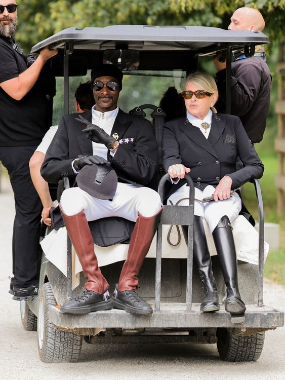 03 August 2024, France, Versailles: Olympics, Paris 2024, equestrian sport, dressage, team, final, US rapper Snoop Dogg rides a golf cart.  Pic: PA 