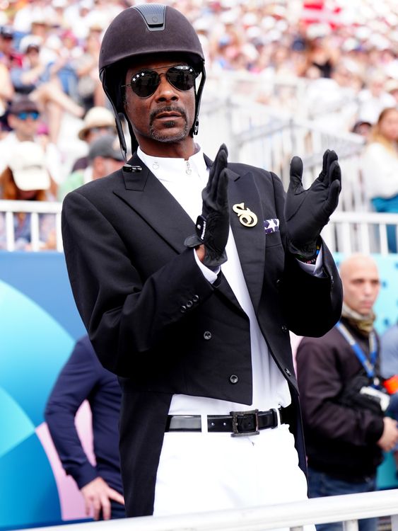 Snoop Dogg watching the Dressage Team Grand Prix Special at the Chateau de Versailles on the eighth day of the 2024 Paris Olympic Games in France. Picture date: Saturday August 3, 2024. Mike Egerton/PA Wire