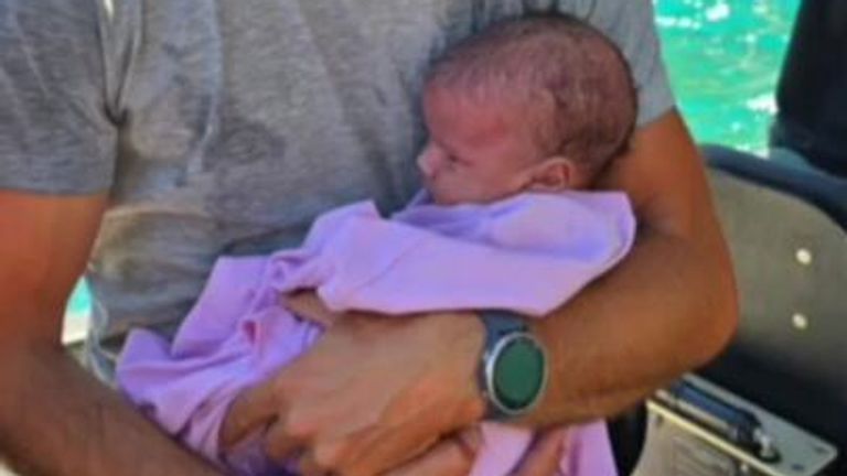 Baby rescued after being stranded on island for three days