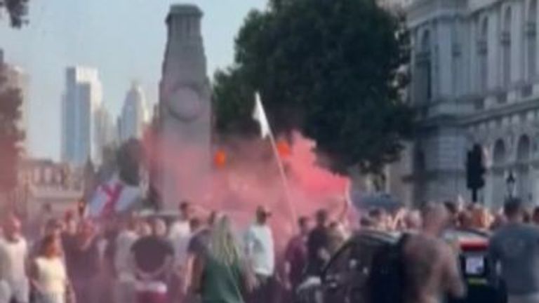 Protesters were seen throwing flares and clashing with the police outside Downing Street.