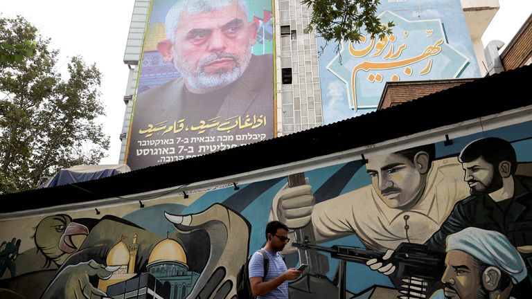 A billboard with a picture of newly appointed Hamas leader Yahya Sinwar is displayed on a building in a street in Tehran, Iran, August 12, 2024. Majid Asgaripour/WANA (West Asia News Agency) via REUTERS  ATTENTION EDITORS - THIS PICTURE WAS PROVIDED BY A THIRD PARTY