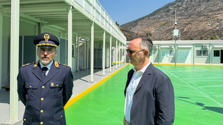 Italian State Police manager Evandro Clementucci (left), and Italy's Ambassador to Albania, Fabrizio Bucci (right). Speaking at a migrant centre under construction in Albania - this one is in Shengjin - north of the Albanian capital, Tirana. The sites are due to be run by Italian officials to process the asylum applications of migrants they have recovered from international waters. Footage taken: 01/08/2024