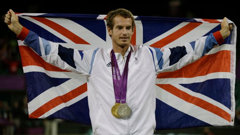 Andy Murray poses with his gold and silver medals at the 2012 Summer Olympics. Pic: AP