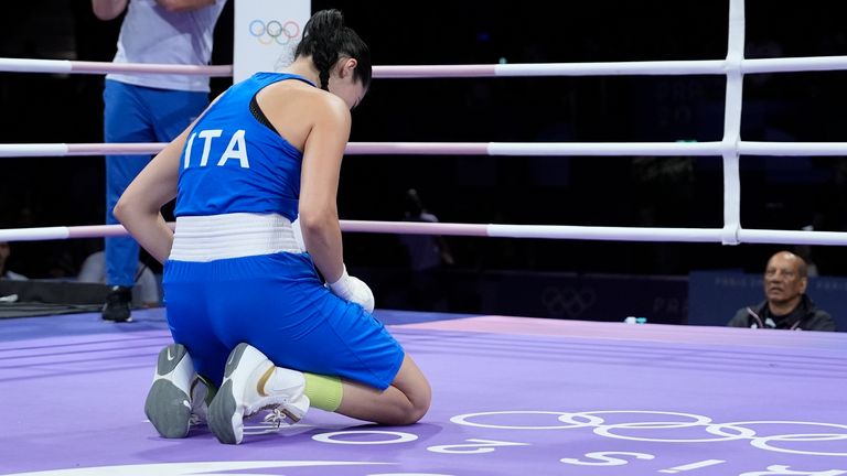 Italy's Angela Carini reacts after she was defeating by Algeria's Imane Khelif, in their women's 66kg preliminary boxing match at the 2024 Summer Olympics, Thursday, Aug. 1, 2024, in Paris, France. (AP Photo/John Locher)