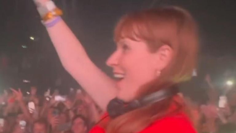 Angela Rayner raves behind DJ booth.