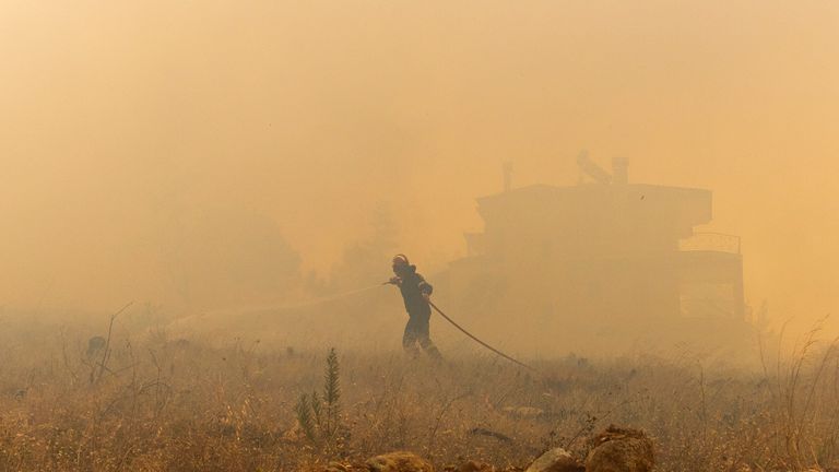 A firefighte near Athens.
Pic: AP