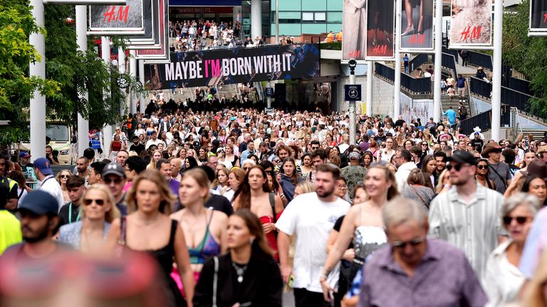 Fans gather outside Wembley Stadium ahead of Taylor Swift's latest Eras Tour concert. 
Pic: PA