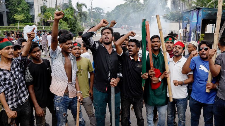 Demonstrators shout slogans after they have occupied a street in Dhaka. Pic: Reuters