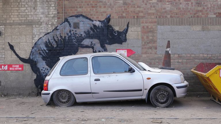 Banksy’s eighth animal image is a rhino mounting a car in Charlton, southeast London. Pic: PA qhidqhihrieinv