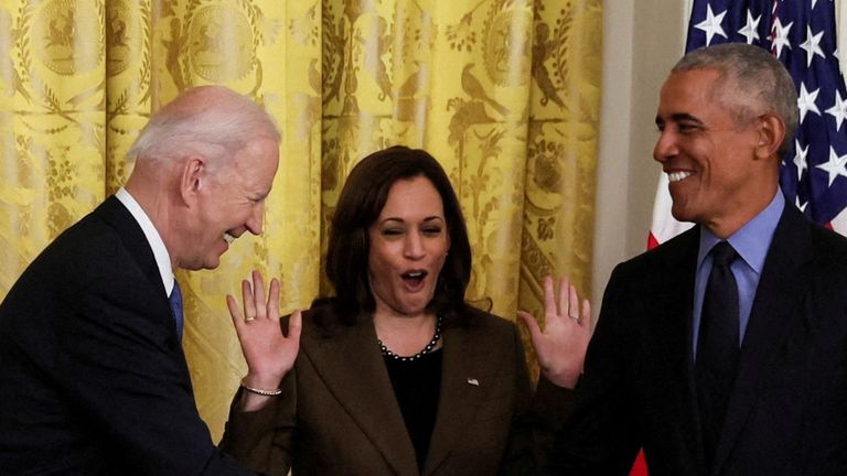 FILE PHOTO: U.S. President Joe Biden greets friend and former President Barack Obama during an event on the Affordable Care Act, the former president's top legislative accomplishment, as Vice President Kamala Harris reacts in the East Room at the White House in Washington, U.S., April 5, 2022. Picture taken April 5, 2022. REUTERS/Leah Millis/File Photo
