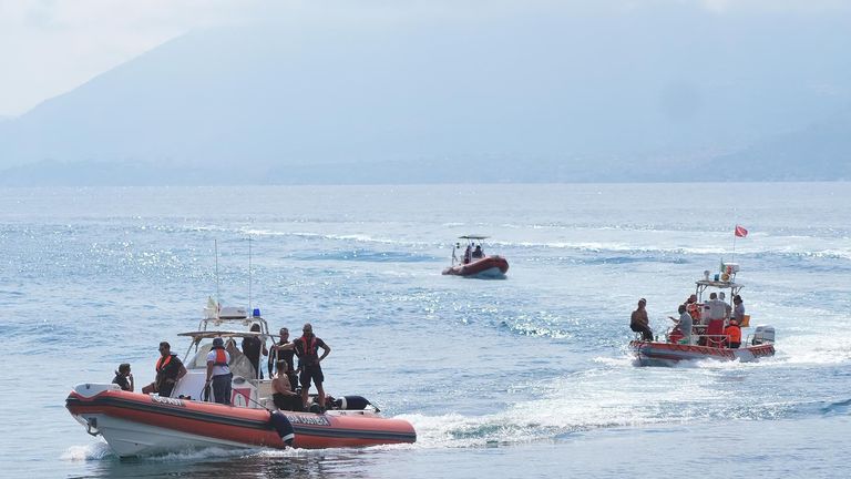 Dive teams return to harbour from the dive site of the Bayesian.
Pic: PA