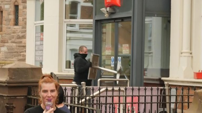 Protester fails to break hotel door