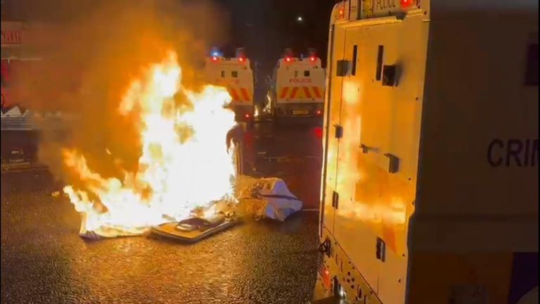 Around a dozen people wearing balaclavas and masks threw petrol bombs at police
