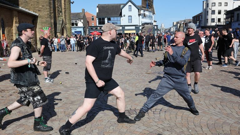 A fight breaks out between anti-fascists (left) and people protesting in Blackpool, following the stabbing attacks on Monday in Southport, in which three young children were killed. Picture date: Saturday August 3, 2024.

