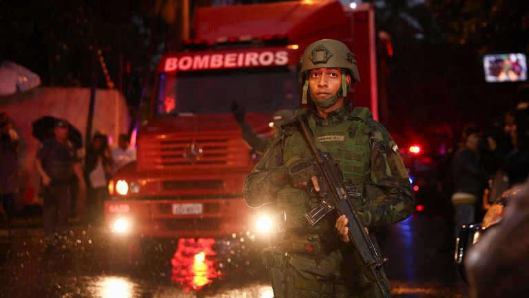 Security services at the scene. Pic: Reuters