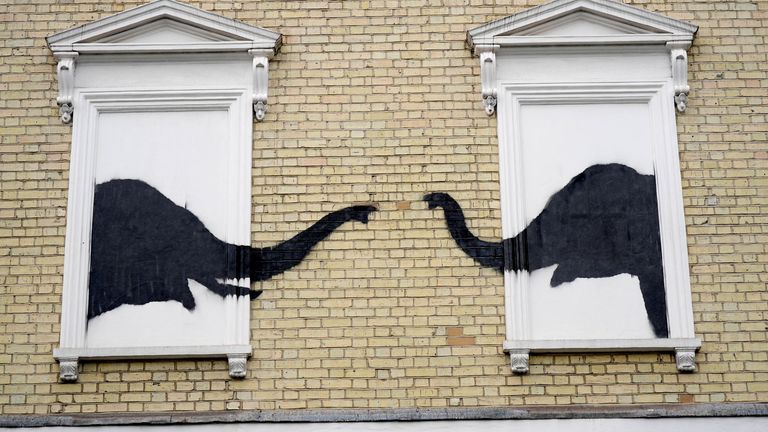 A new artwork depicting two elephants poking their heads out of blocked out windows unveiled by Banksy on the side of a building at the junction of Edith Grove and Edith Terrace, in Chelsea.
Pic: PA