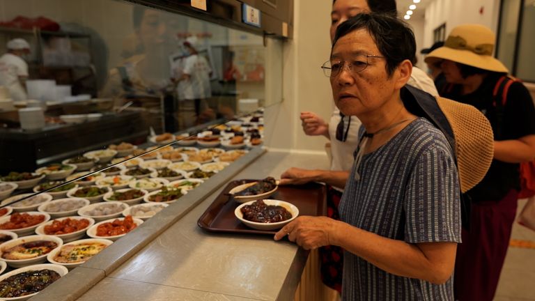 Jiang Jinzhu, a retired teacher, at a community canteen in Shanghai